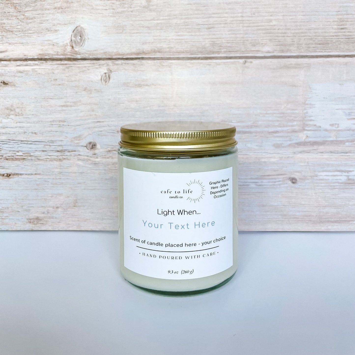 Glass candle with gold top. Label says, “Your Text Here” and customizable for anyone who purchases it.